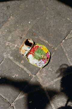 Colorful Offering Placed on the Cobblestone Street