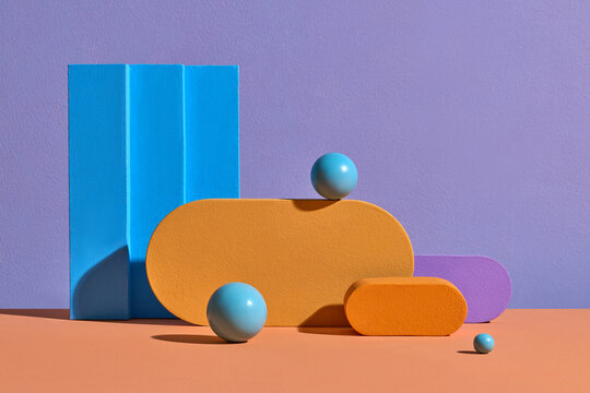 Colorful Geometric Shapes Against Purple and Blue Background
