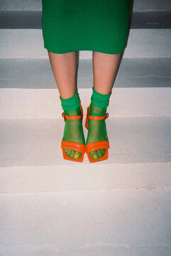 Green socks with hole and orange heels, film