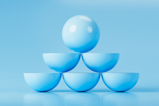 Glossy Blue Sphere Balanced on Semi-Spherical Stack