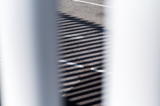 Abstract shadow patterns on pavement