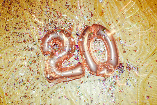 number 20 and confetti, shutter dragging effect