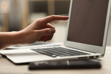 Businessman using laptop at table, closeup. Modern technology