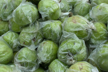 Fototapeta premium texture and background of guava wrapped in plastic. Crystal guava is wrapped individually in plastic