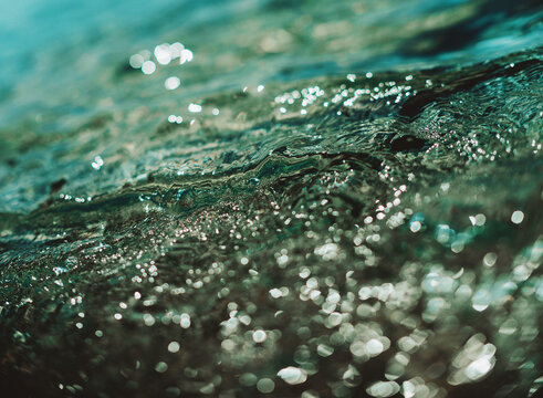 Sparkling water surface reflecting sunlight during daytime hours