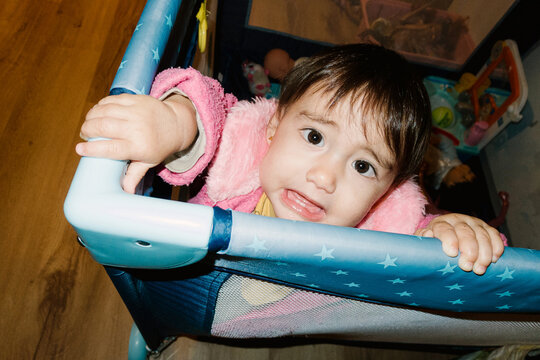 UGC Girl clinging to the crib railing