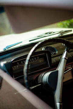 Car dashboard speedometer and steering wheel of a classic car 