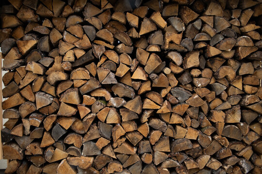 firewood in the woodshed in the yard