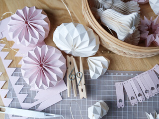 Delicate paper stars, trees, clothespins and geometric ornaments