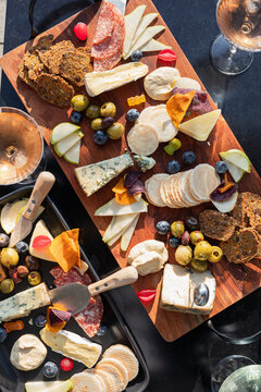 Elegant cheese platter with assorted fruits and crackers