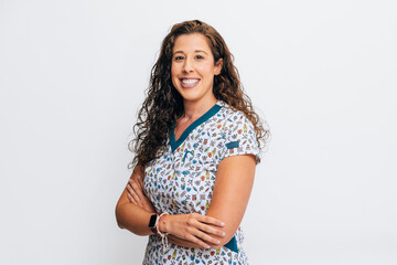 Confident female healthcare professional in a patterned uniform