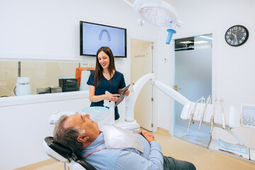 Dentist and patient interaction in a modern dental office