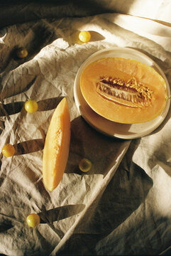 A still life featuring sliced melon