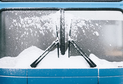  frozen blue bus covered the snow