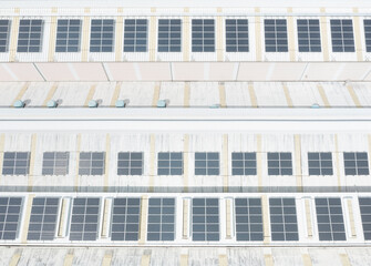 Rooftop solar panels arranged in neat rows for solar energy prod