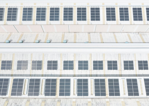 Rooftop solar panels arranged in neat rows for solar energy prod