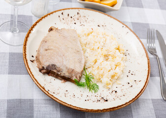 Seared tuna steak served with boiled white rice for dinner. Dietary seafood dish..