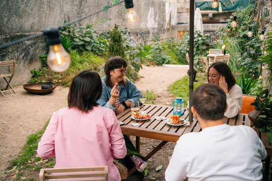 Group Enjoying Outdoor Dining in Relaxed Atmosphere