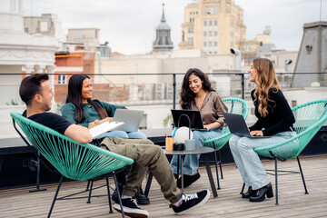 Team brainstorming on rooftop terrace