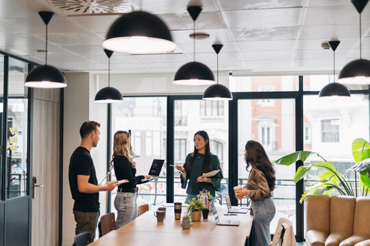 Team collaborating in modern office with natural light