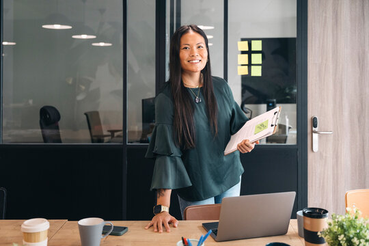 Confident professional presenting in a modern office