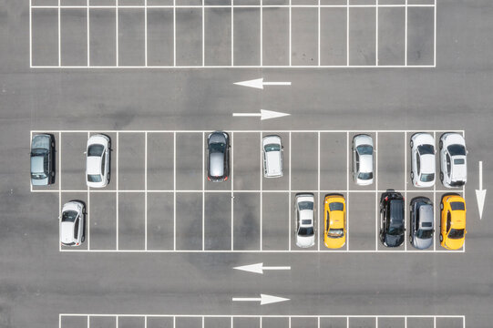 Aerial View of a Well Organized Parking Lot with Various Cars