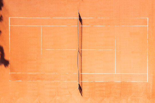 Aerial view of a red clay tennis court