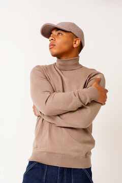 man  in stylish sweater and cap 