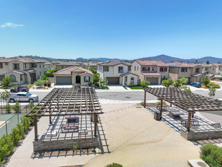 Fototapeta premium Covered gathering area in community park with picnic tables, Escondido, San Diego, California