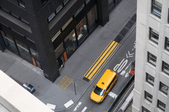 Street corner with a yellow van from above at Manhattan