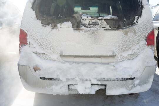 Snow-Covered Car Back