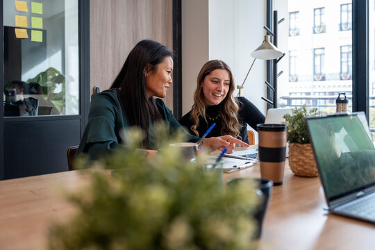 Team collaboration in a modern office setting - Powered by Adobe