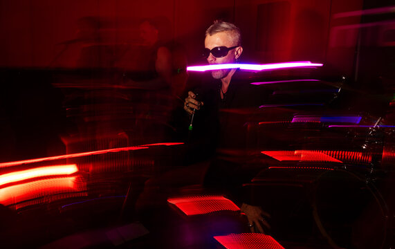Dynamic concert lighting with performer in motion blur