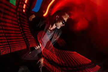 Dynamic singer in red spotlight with motion blur effect