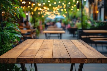 Fototapeta premium Blank wooden tabletop with a blurred cafe backdrop