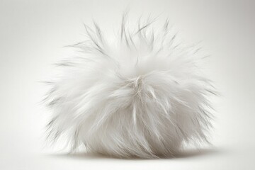 Fototapeta premium A fluffy ball of white fur on a white surface