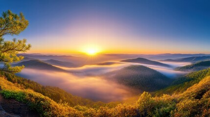 Fototapeta premium A panoramic mountain sunrise, with layers of fog rolling through the valleys and warm light highlighting the ridges.