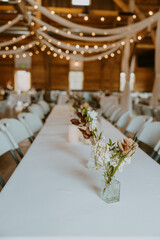 Rustic Barn Wedding Reception with String Lights and Wooden Decor