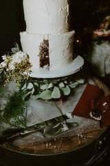 cut and eaten wedding cake with flowers