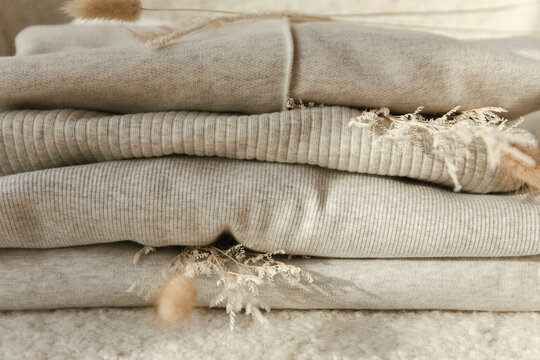 Folded sweaters on the chair