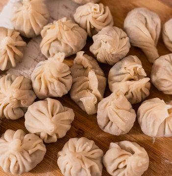 Close-up of freshly made  homemade dumplings on a kitchen table
