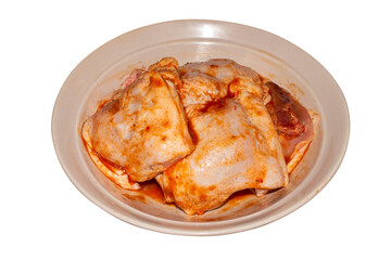 Chicken thighs in marinade.Chicken in marinade background.Marinated chicken with spices.