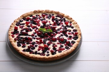 Delicious currant pie on white wooden table