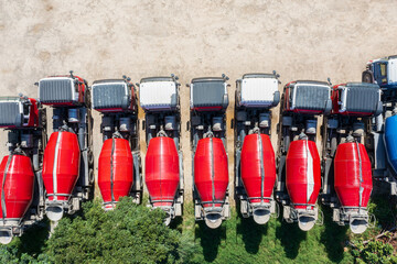 Aerial View of Concrete Mixer Trucks Lined Up at Construction Si