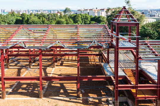 Building Under Construction with Red Steel Frames