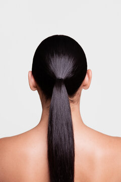 Back View of a Woman with Sleek, Shiny Hair in a Ponytail