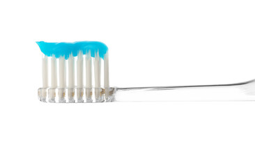 One toothbrush with toothpaste in air isolated on white