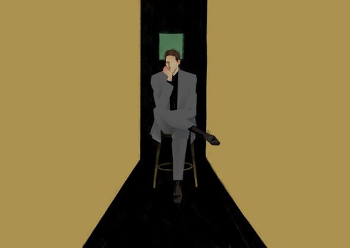 businessman is sitting in a thoughtful pose