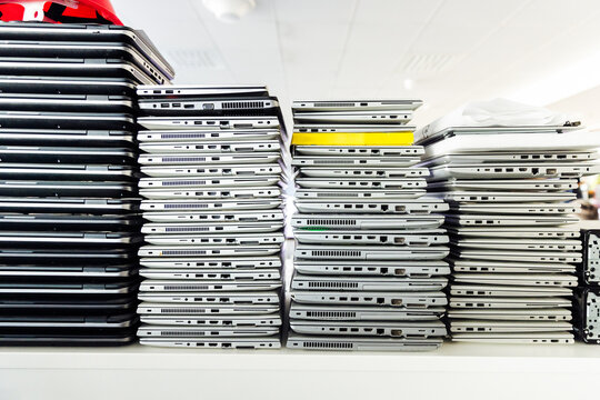 Broken old laptops stacked