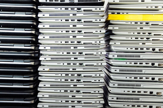 Broken old laptops stacked